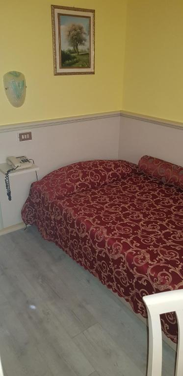 Postel nebo postele na pokoji v ubytování Hotel Monna Lisa
