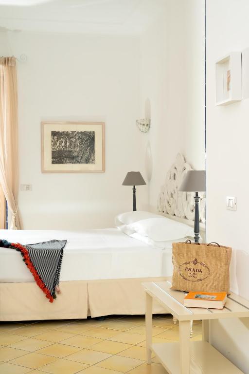 Voodi või voodid majutusasutuse Boutique Hotel Casa Mariantonia toas