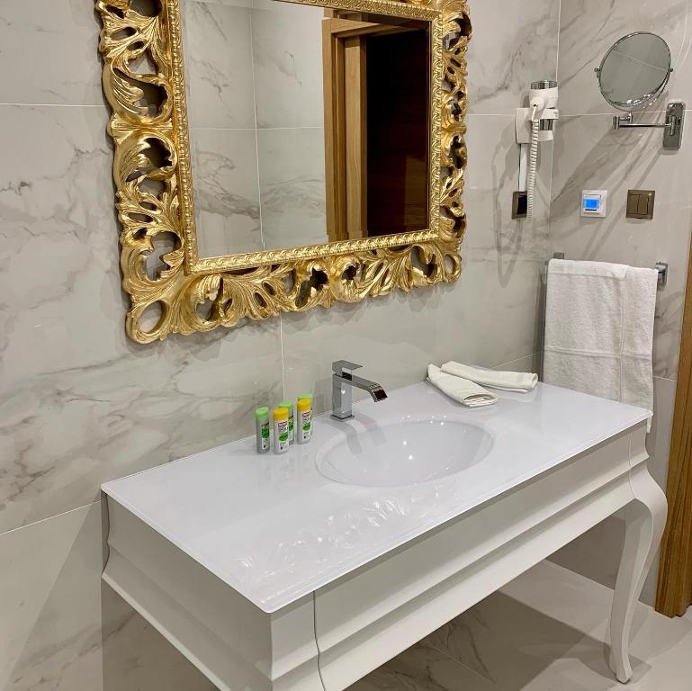 Koupelna v ubytování Rosso Aparthotel