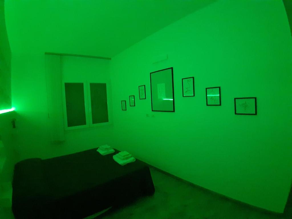 A bed or beds in a room at CASA ALEXSA Intero appartamento o CAMERA ALEXSA Camera matrimoniale con patio