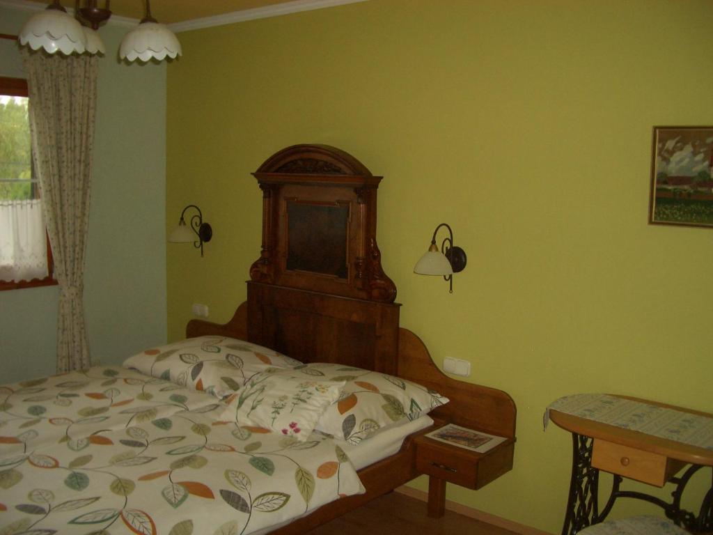 Postel nebo postele na pokoji v ubytování Bundi Vendégház