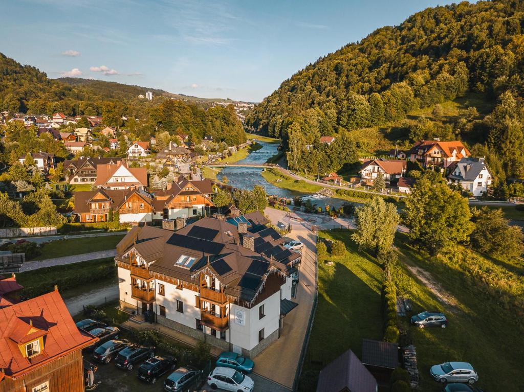 an aerial view of a town with a river and houses at Apartamenty Eko in Szczawnica