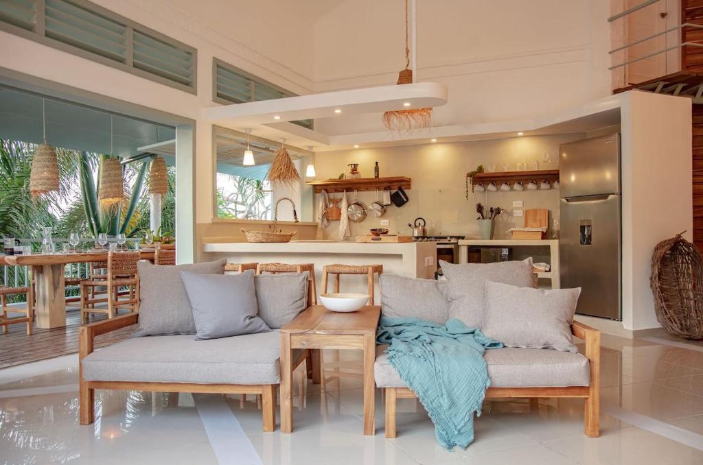 a kitchen and dining room with a table and chairs at Tropical Penthouse in the Heart of Las Terrenas! in Las Terrenas