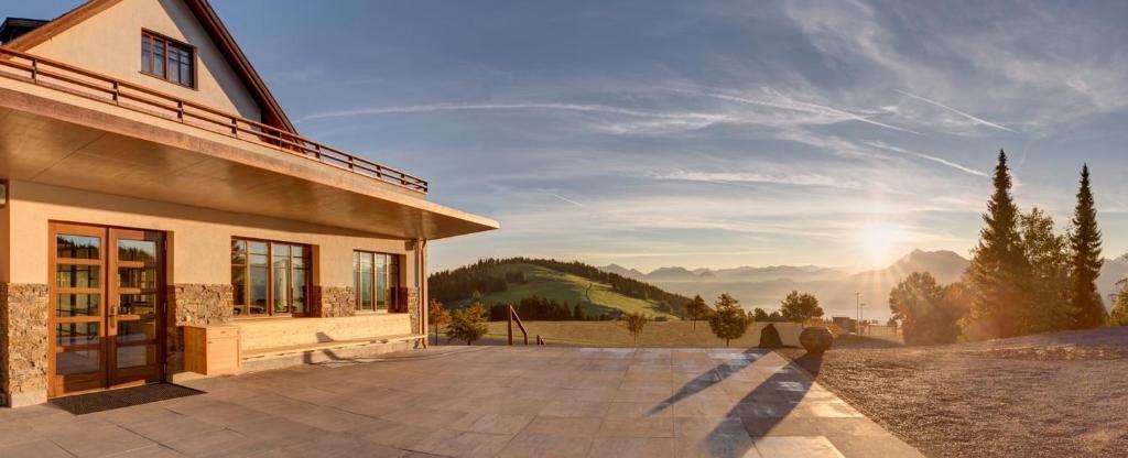 a house with a view of a mountain at Alpenhotel Bödele - Comfort Suite 11 in Schwarzenberg