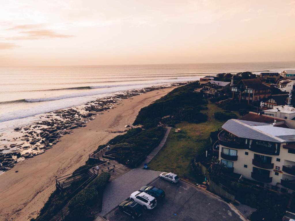 an aerial view of the beach and houses at African Perfection 1 in Jeffreys Bay