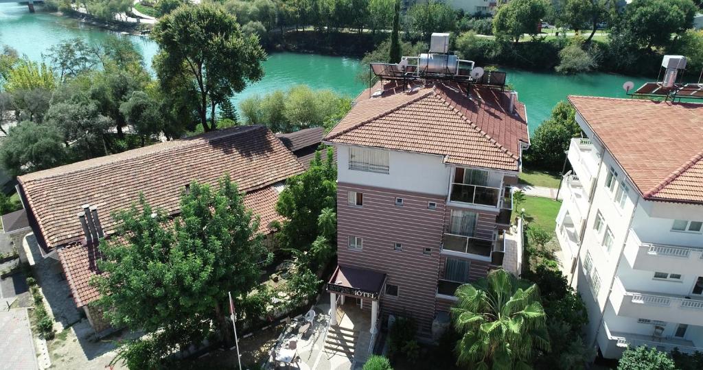 an aerial view of a building and a river at River Hotel in Manavgat