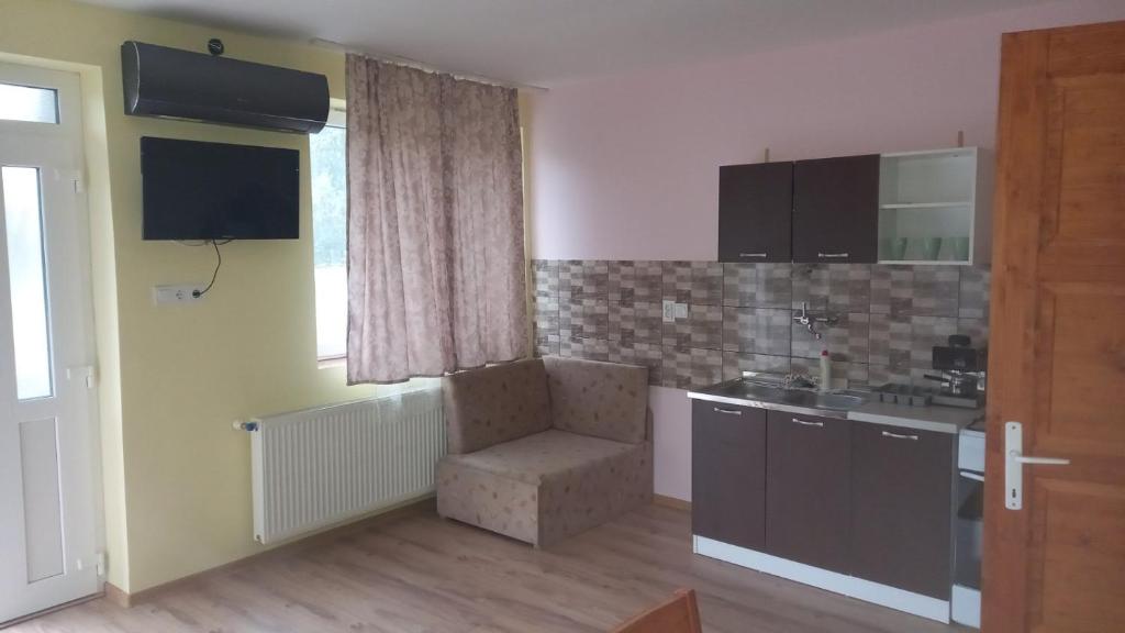 Telewizja i/lub zestaw kina domowego w obiekcie Gecse-Villa