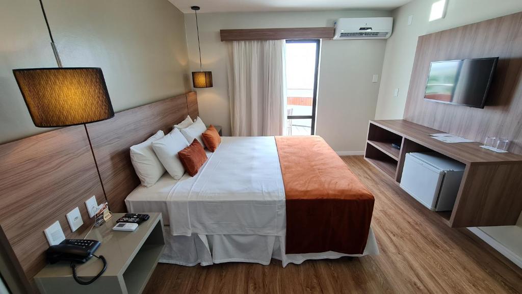 Postel nebo postele na pokoji v ubytování Brisamar Hotel & SPA São Luís