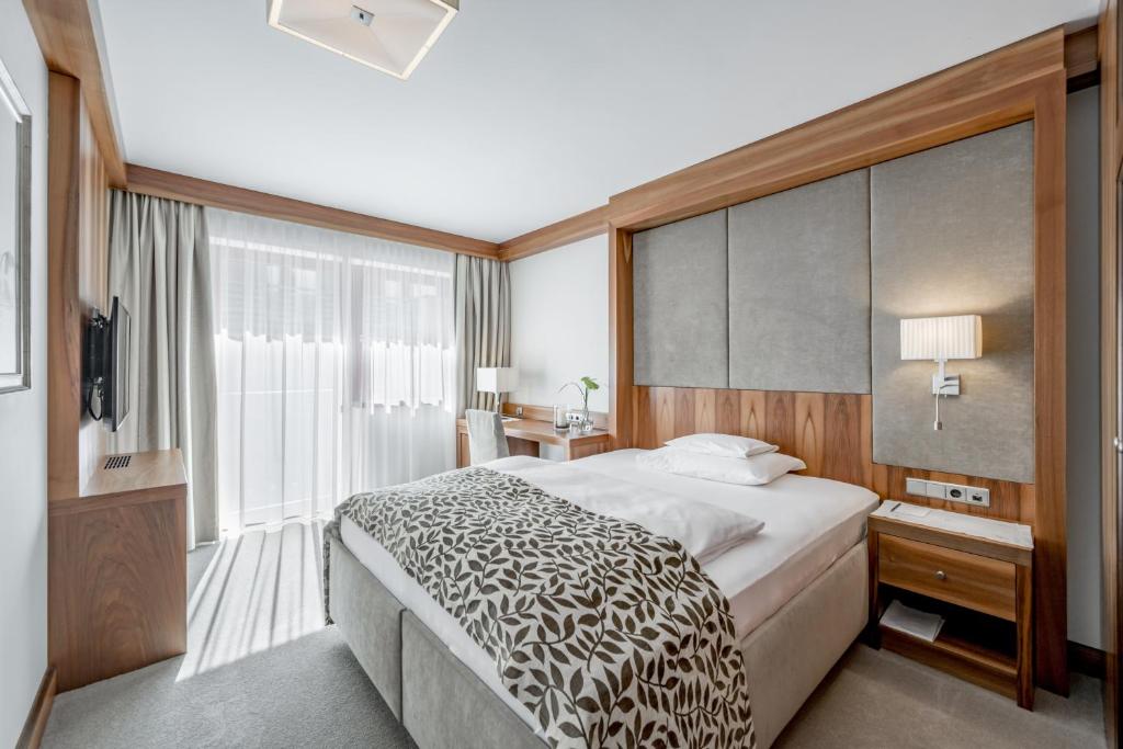 Postel nebo postele na pokoji v ubytování Trofana Royal 5-Sterne Superior Resort