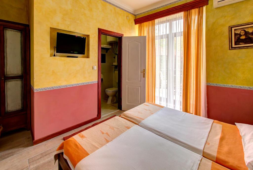Postel nebo postele na pokoji v ubytování Villa Botticelli