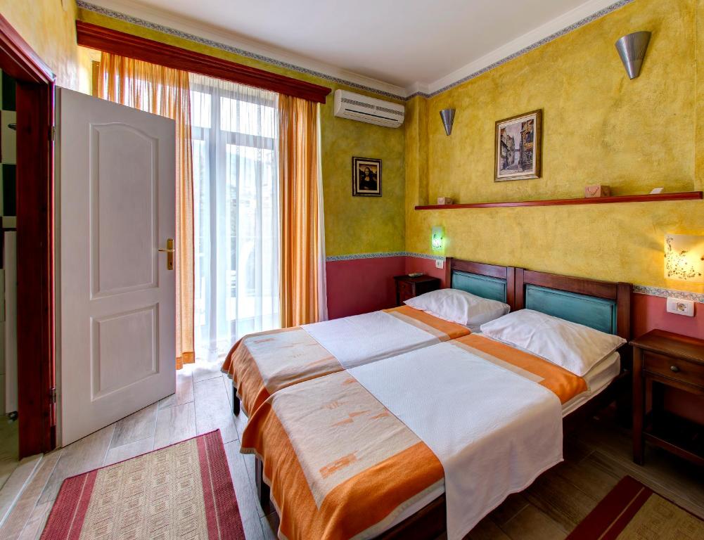 Postel nebo postele na pokoji v ubytování Villa Botticelli