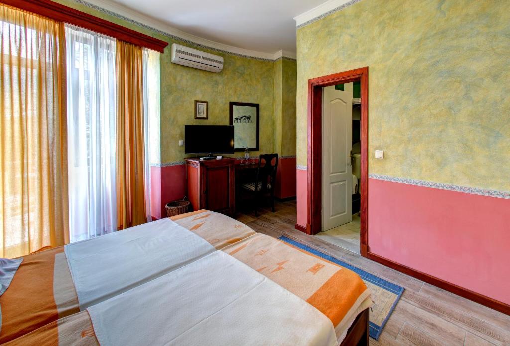 Postel nebo postele na pokoji v ubytování Villa Botticelli