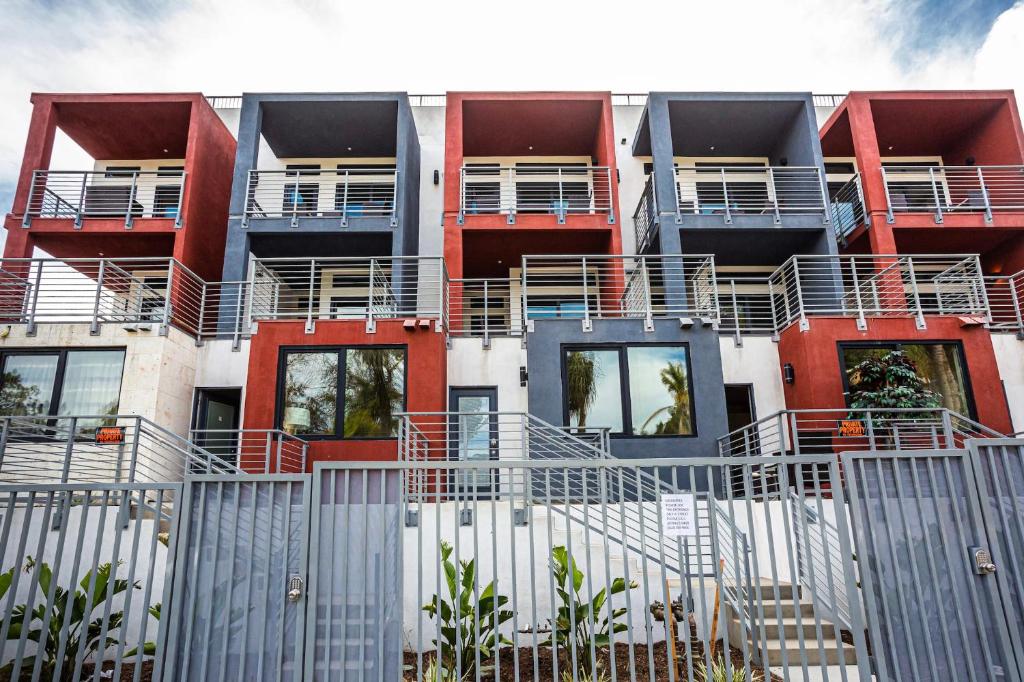 an apartment building with red and blue balconies at 3 Floor TownHouse Next to Downtown Max 12 sleepers in San Diego