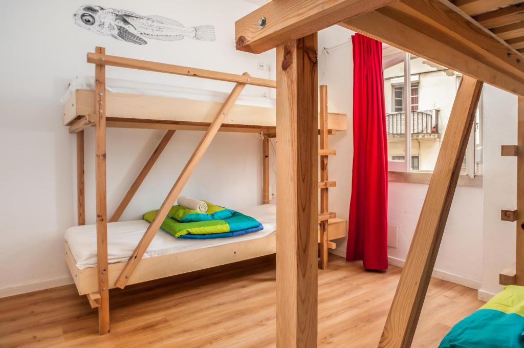 Postel nebo postele na pokoji v ubytování Nazaré Hostel - Rooms & Dorms