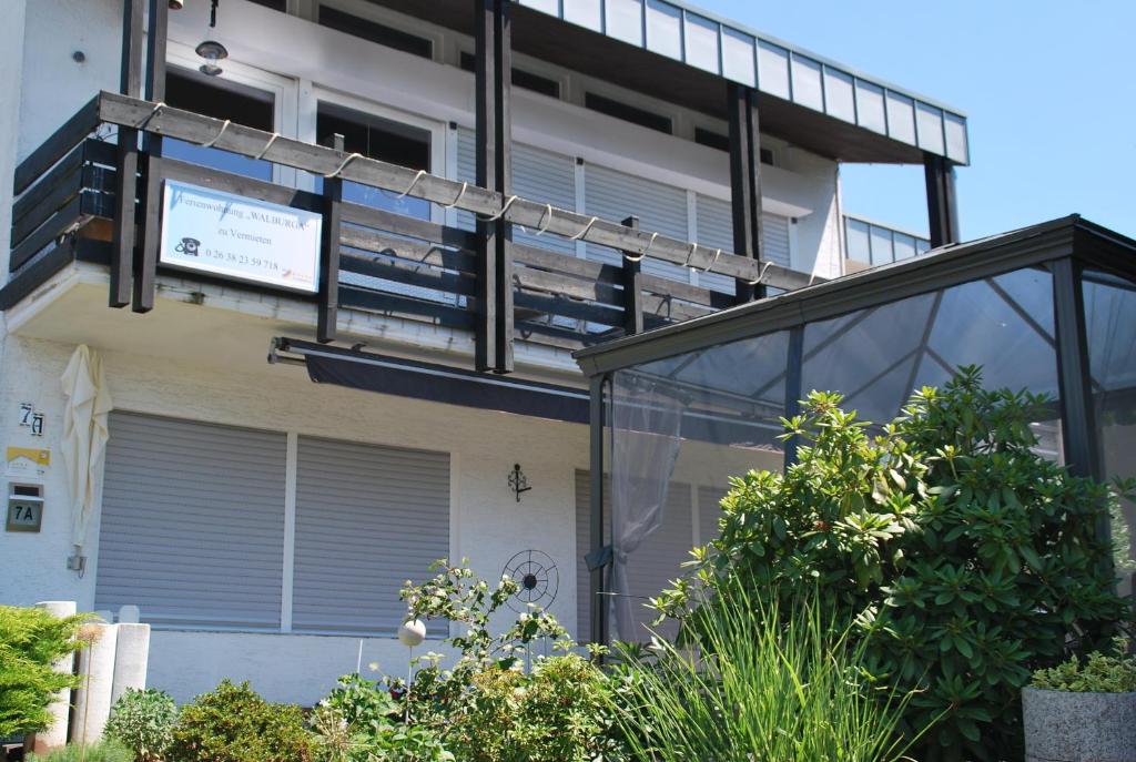 an external view of a house with a balcony at FeWo Walburga in Roßbach