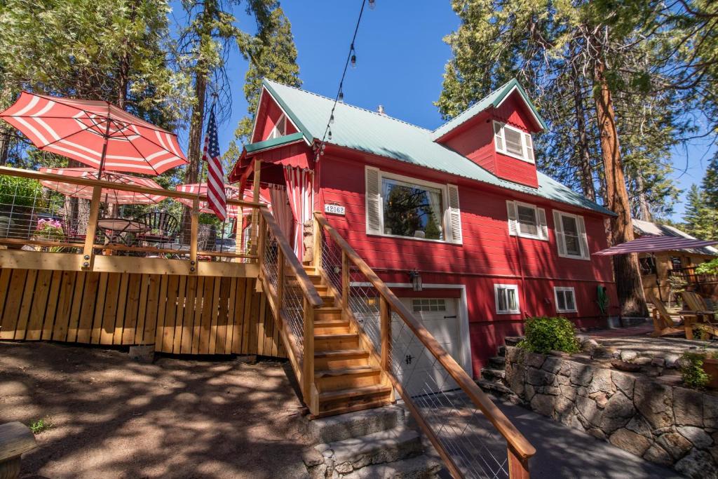 a red house with a staircase leading up to it at Elliott House Boutique Inn in Shaver Lake