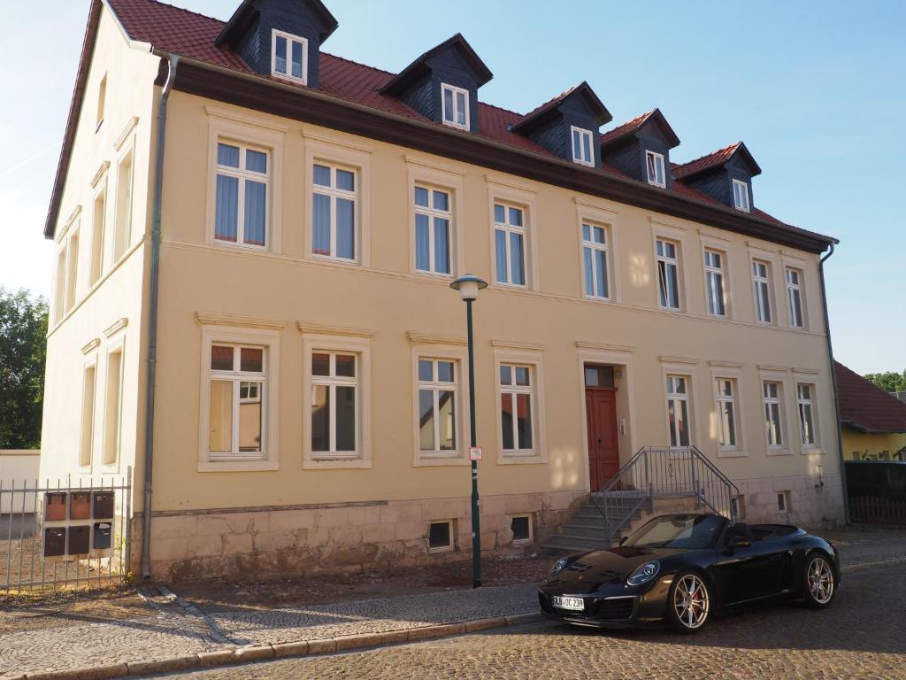 a black car parked in front of a building at Askanier in Ballenstedt