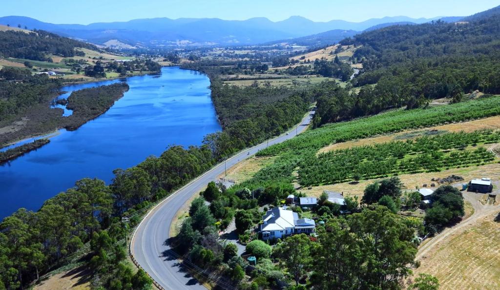 an aerial view of a river with a house and a road at Hillside Bed and Breakfast in Huonville