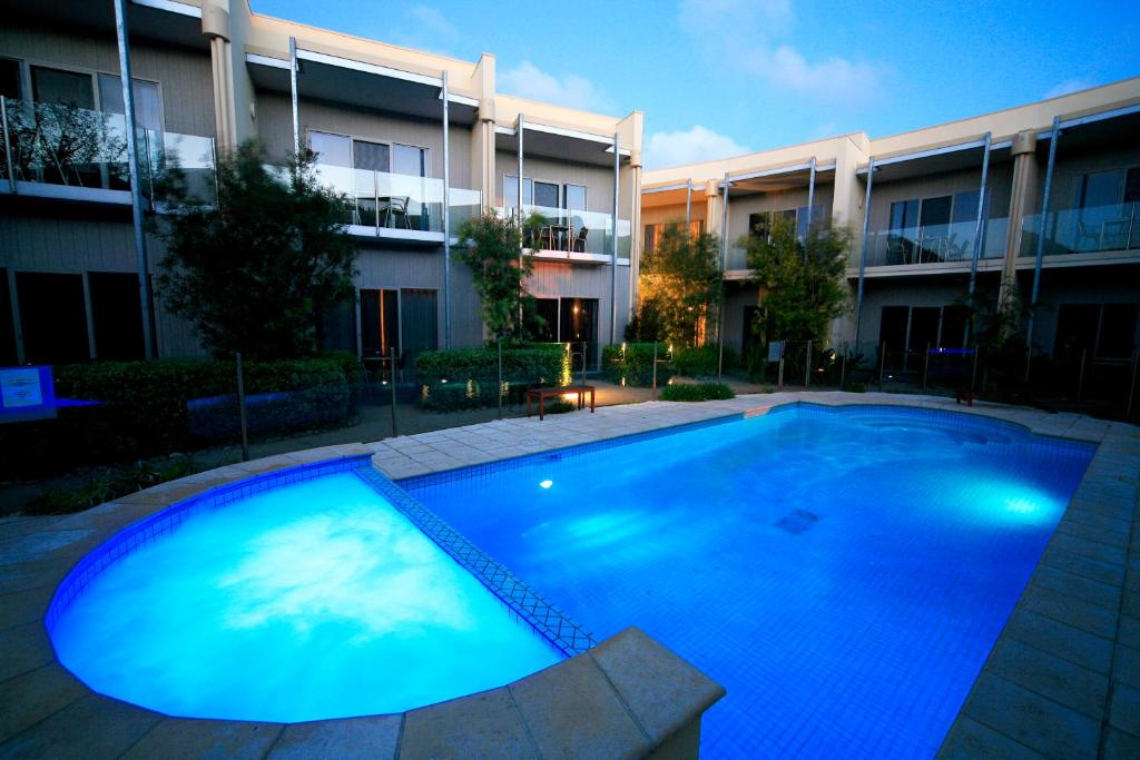 a large swimming pool in front of a building at Rye Hotel - One Four Nelson in Rye