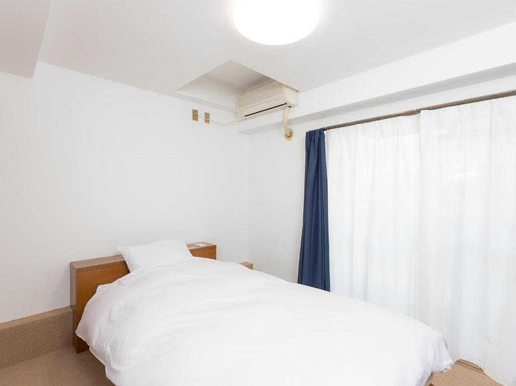 Postel nebo postele na pokoji v ubytování Hotel WWJ