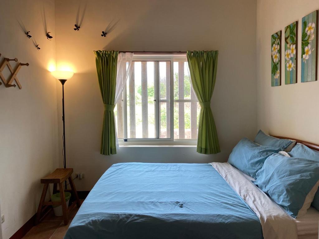 Postel nebo postele na pokoji v ubytování Cheng Village