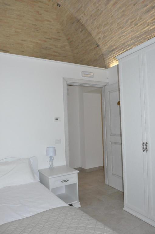 A bed or beds in a room at RELAIS SAN MARCO LUXURY GUEST HOUSE