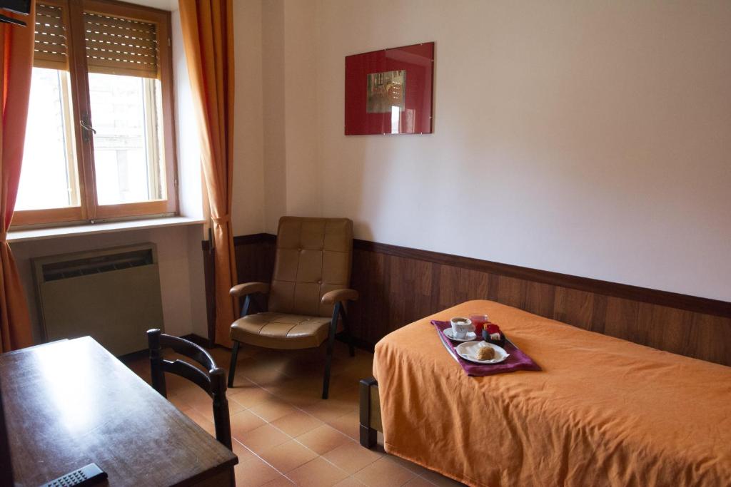 Postel nebo postele na pokoji v ubytování Hotel Caldora