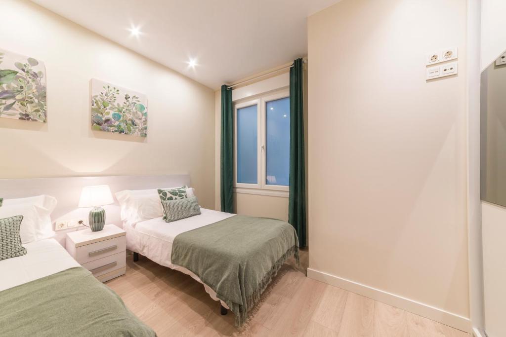 Posteľ alebo postele v izbe v ubytovaní Apartamentos Bellas Artes