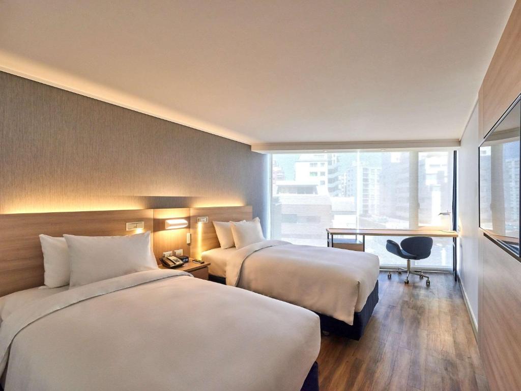 Cama o camas de una habitación en Pullman Vina del Mar San Martin