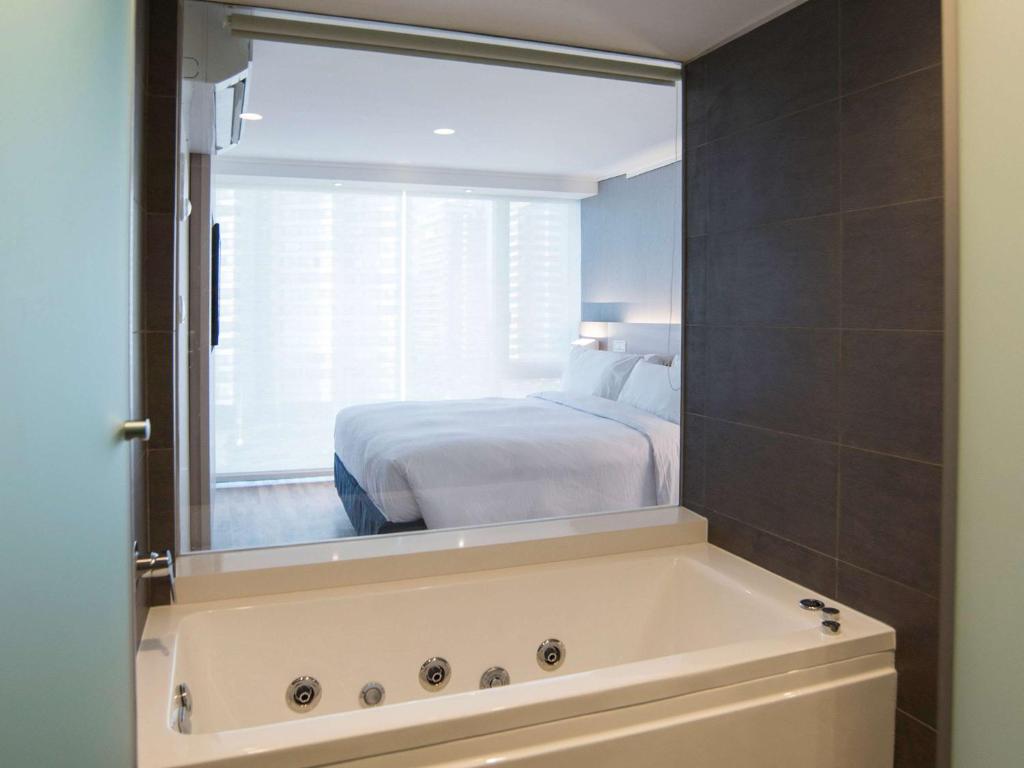 Cama o camas de una habitación en Pullman Vina del Mar San Martin