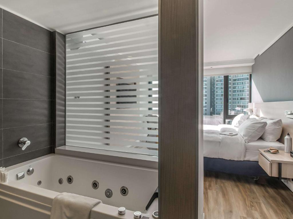 Cama o camas de una habitación en Pullman Vina del Mar San Martin