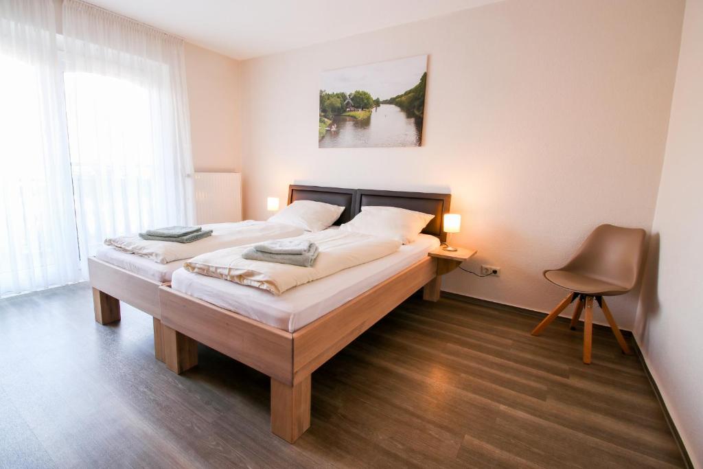 Postel nebo postele na pokoji v ubytování Familienhof Brüning - Ferienwohnung Hofblick