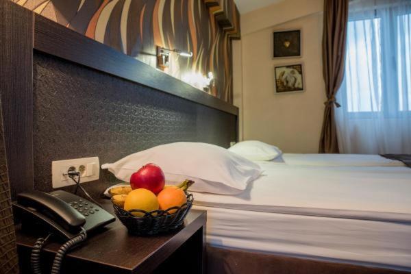 Postel nebo postele na pokoji v ubytování Hotel Crnogorska Kuća