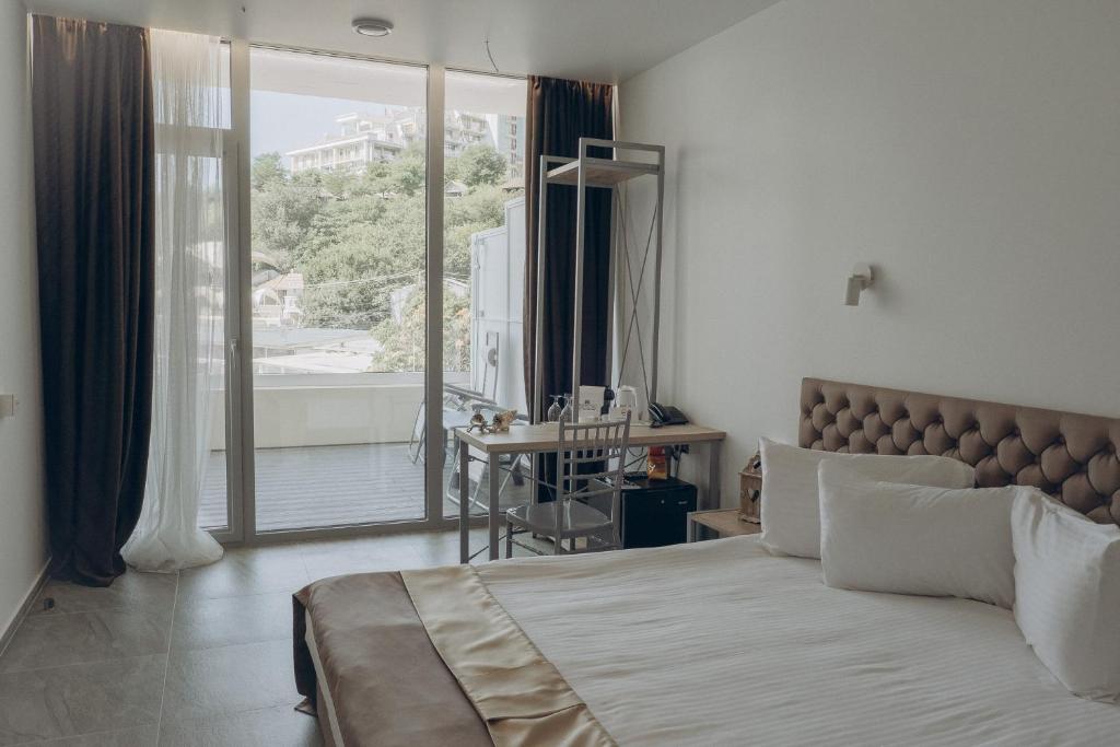 Postel nebo postele na pokoji v ubytování Boutique Hotel Portofino