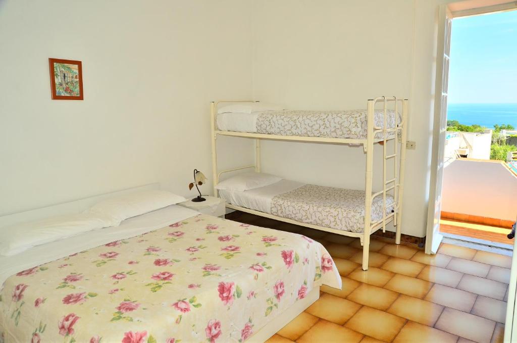 A bed or beds in a room at Hotel Villa Bernardina