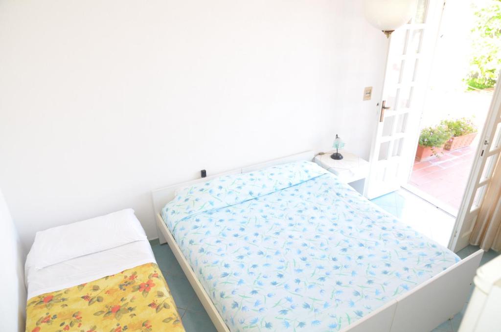 A bed or beds in a room at Hotel Villa Bernardina