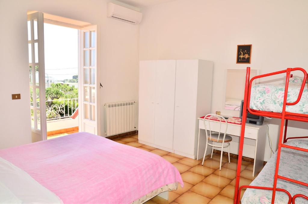 A bed or beds in a room at Hotel Villa Bernardina