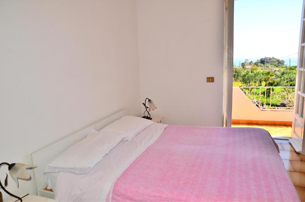 A bed or beds in a room at Hotel Villa Bernardina