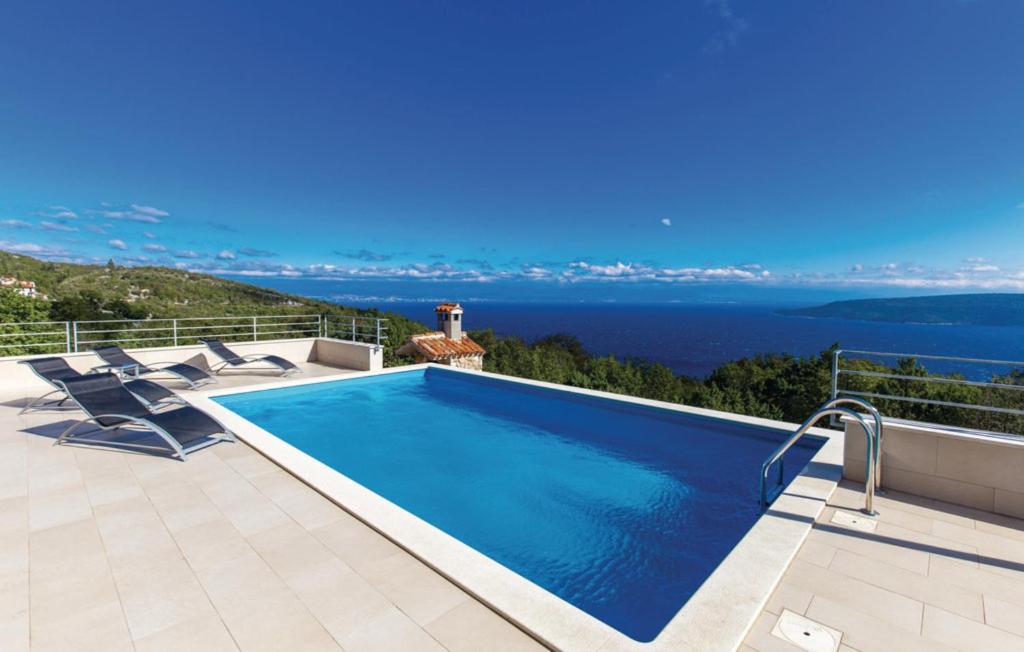 a swimming pool with a view of the ocean at VillaBlu1 Doppelhaushälfte Seaview, Pool in Zagorje