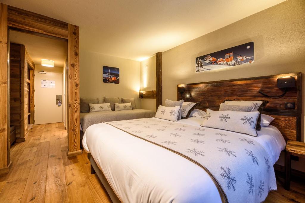 Postel nebo postele na pokoji v ubytování Hôtel Neste de Jade