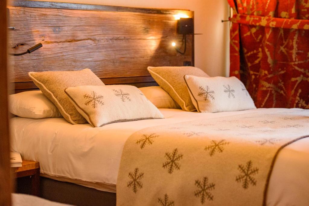 Postel nebo postele na pokoji v ubytování Hôtel Neste de Jade