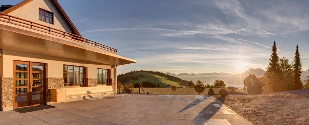a house with a view of a mountain at Alpenhotel Bödele - Luxus Suite mit zwei SZ 22 in Schwarzenberg