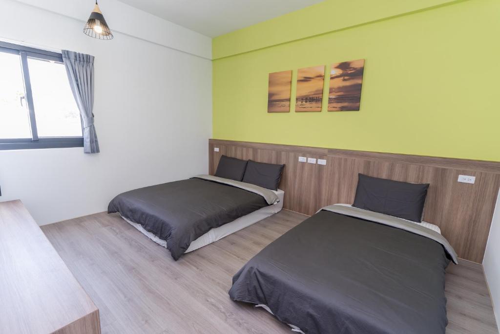 Postel nebo postele na pokoji v ubytování Colorful B&B