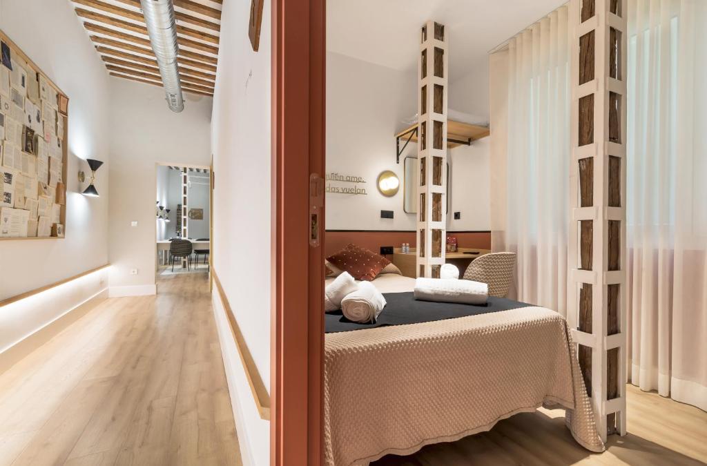 A bed or beds in a room at Cálamo Guesthouse