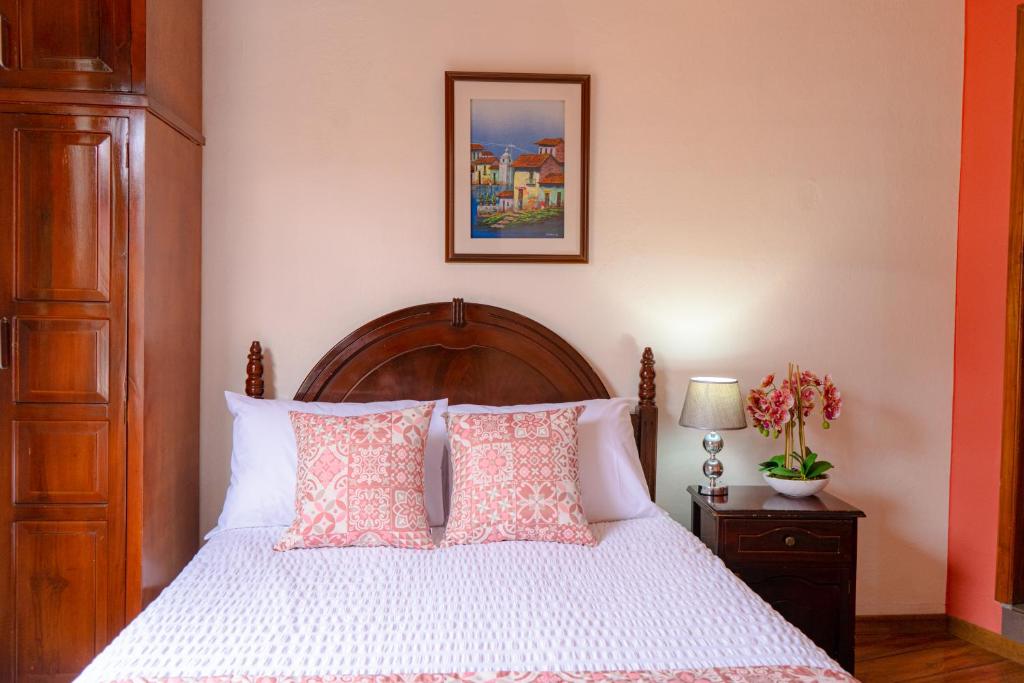 Postel nebo postele na pokoji v ubytování Rincón Familiar Hostel Boutique