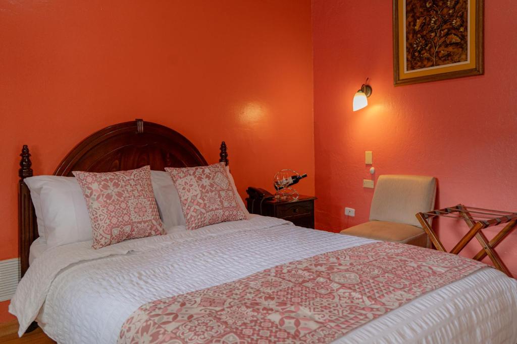 Postel nebo postele na pokoji v ubytování Rincón Familiar Hostel Boutique