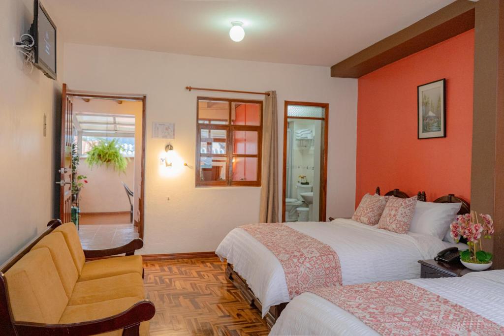 Postel nebo postele na pokoji v ubytování Rincón Familiar Hostel Boutique