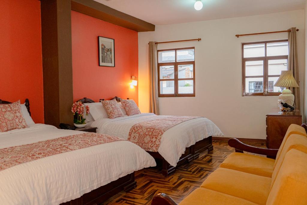 Postel nebo postele na pokoji v ubytování Rincón Familiar Hostel Boutique