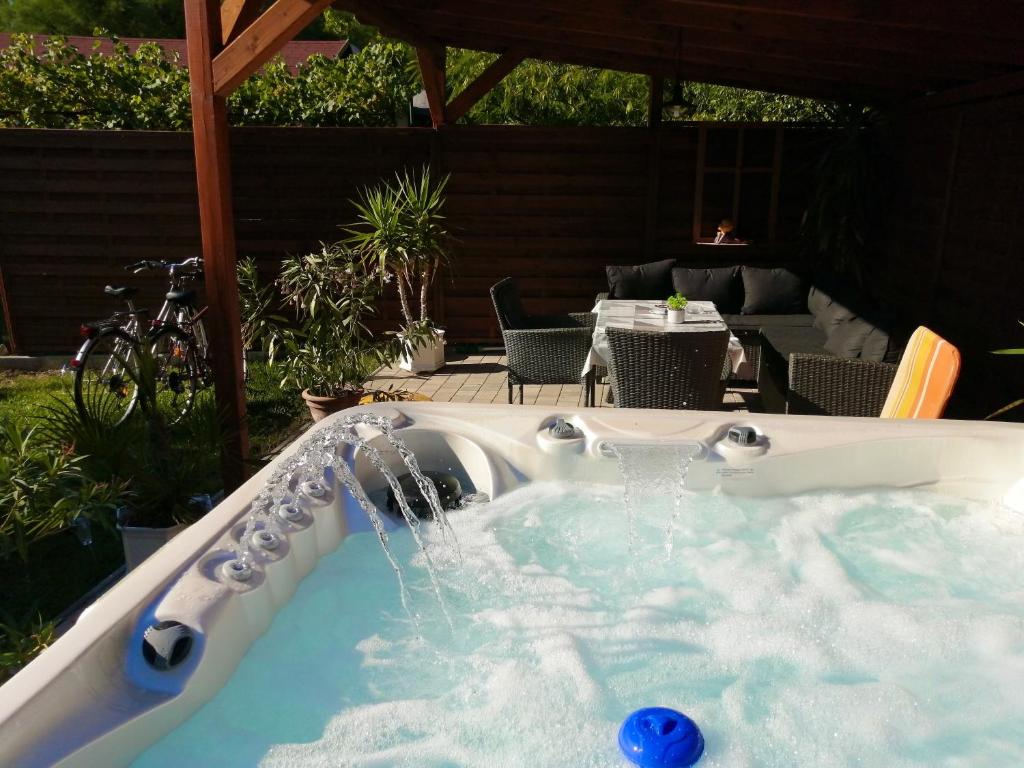 a hot tub with water coming out of it at Villa Terrazza in Balatongyörök