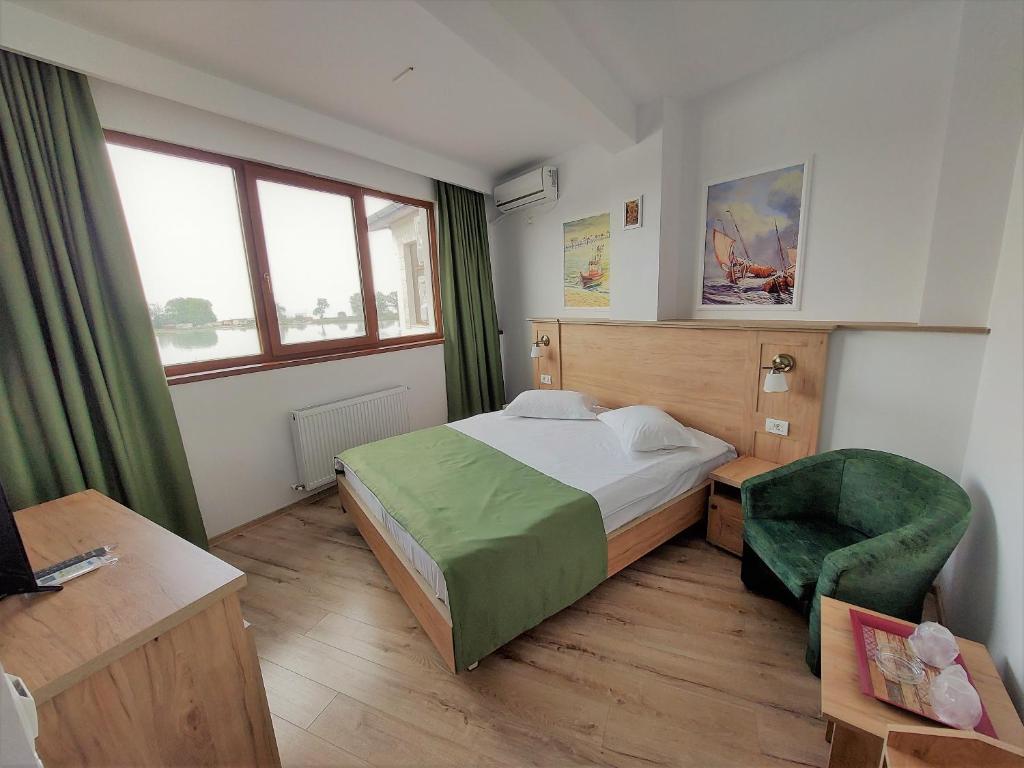 Postel nebo postele na pokoji v ubytování Hotel Insula